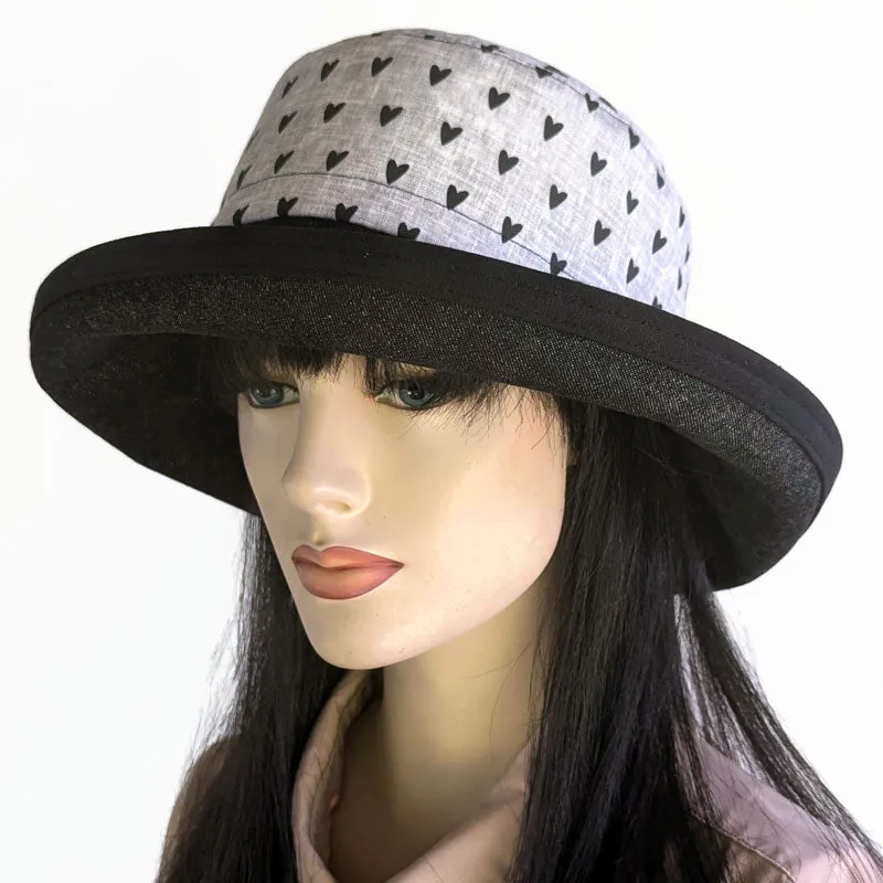 102-h Sunblocker with adjustable fit, black hearts on grey with black denim brim