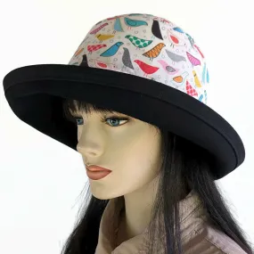 103-b UV Sunblocker with wide brim featuring artsy birds