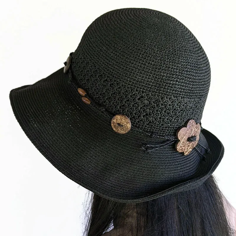 Packable black straw hat with button trim and lovely crochet textures, wired brim edge, adjustable fit